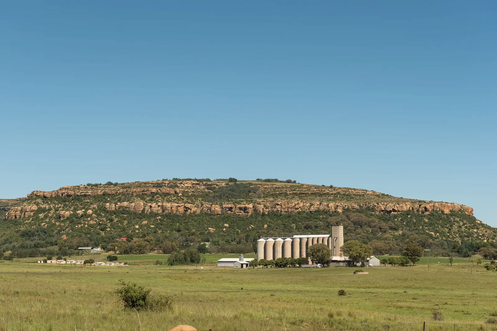 Grain silos below a sandstone ridge at Modderpoort, near Ladybrand in the eastern Free State
