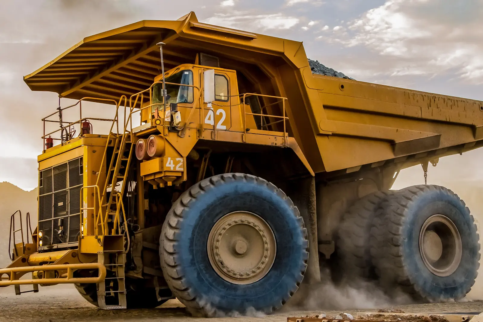 A haul truck loaded with ore at an open-pit mine